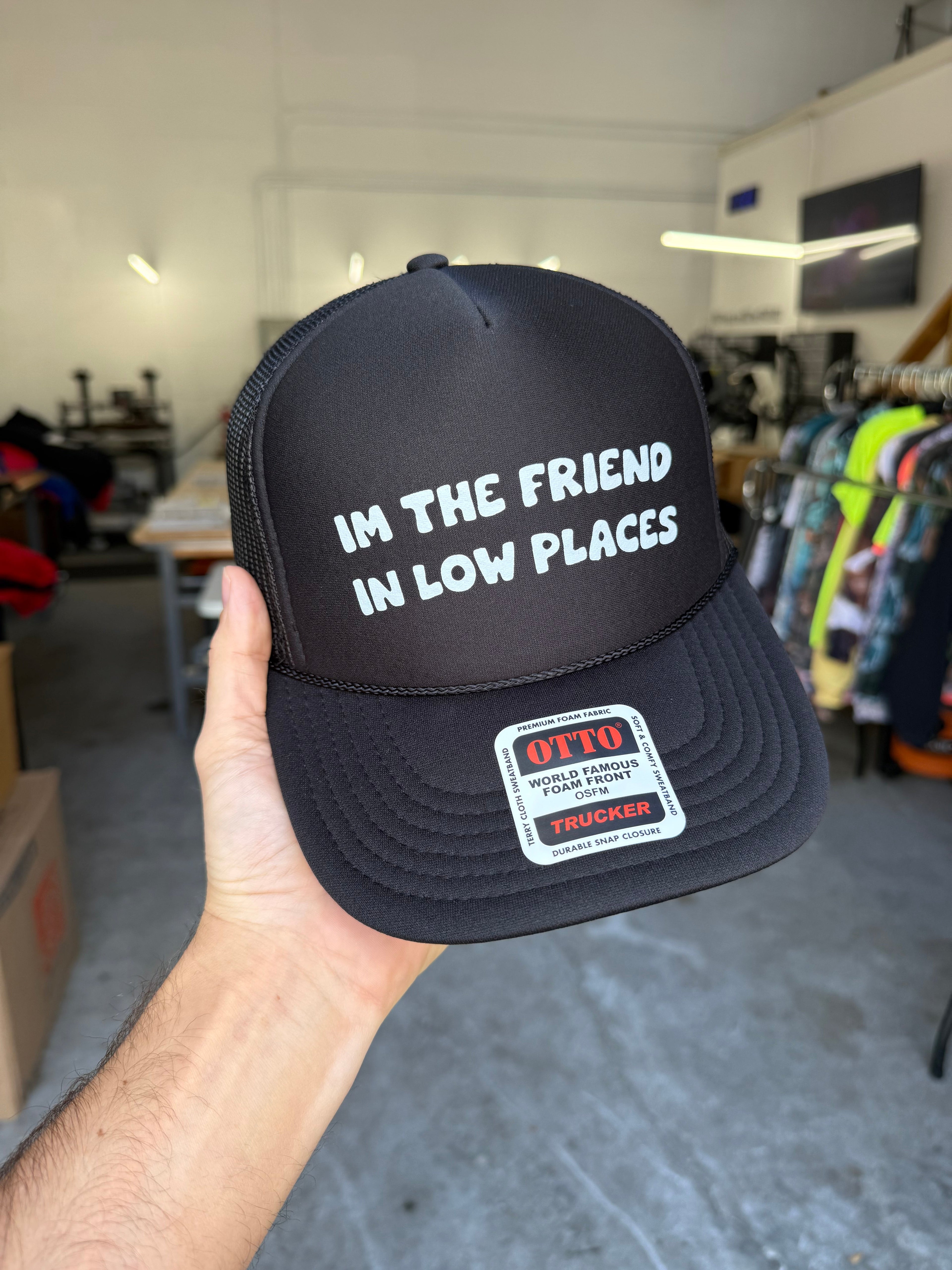 I'm The Friend in Low Places Trucker Hat