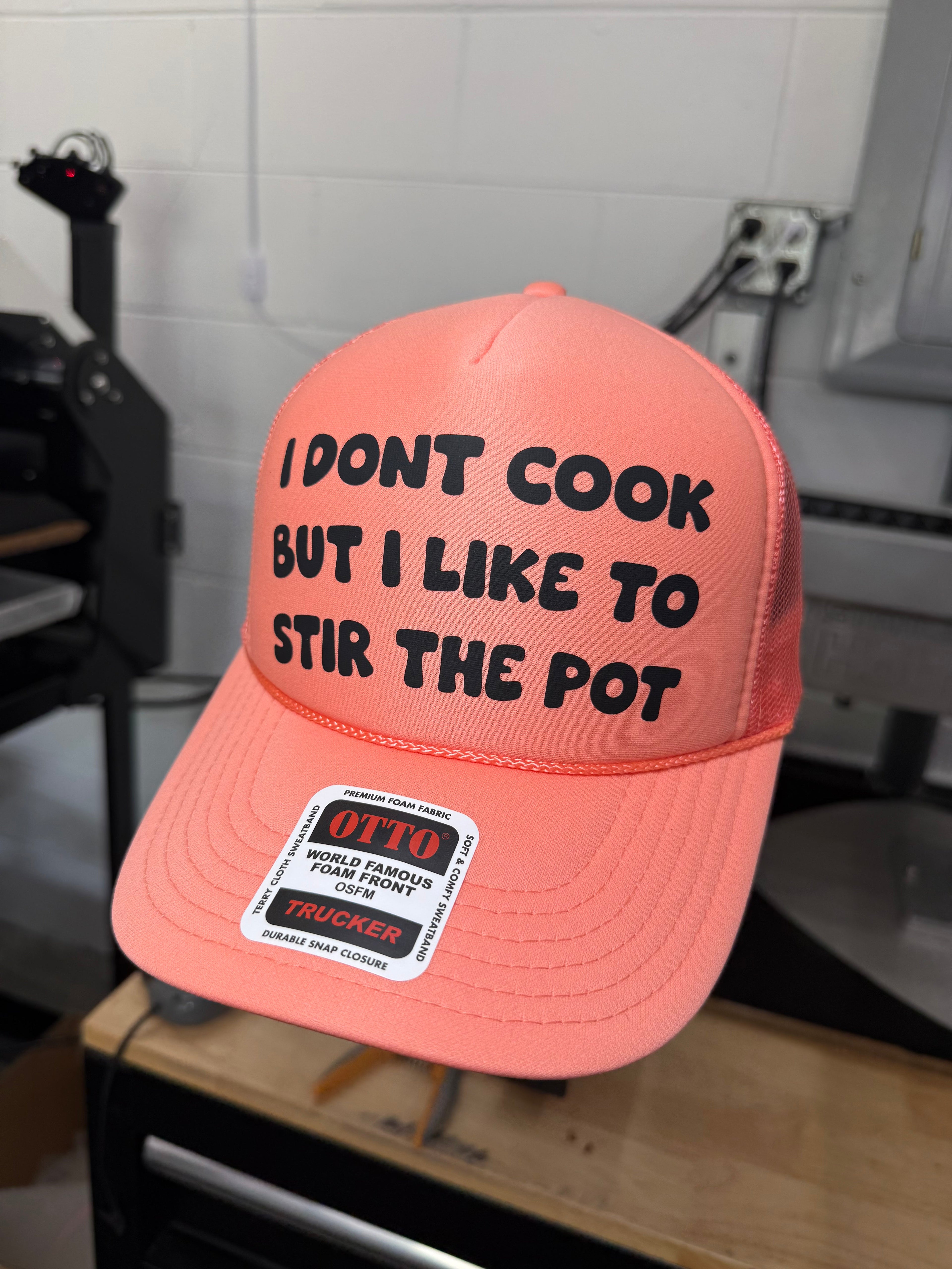 I Don't Cook But I Like to Stir The Pot Trucker Hat
