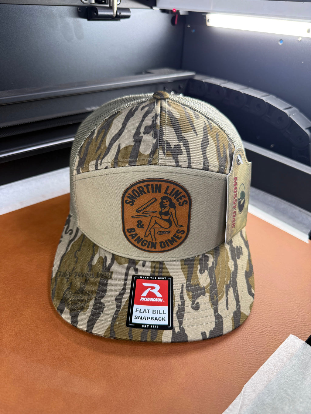 Lines and Dimes | Rawhide Leather Patch Hat Mossy Oak Camo